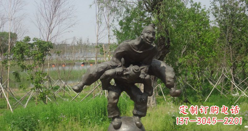 泰州园林站在球上面跳山羊的人物景观铜雕