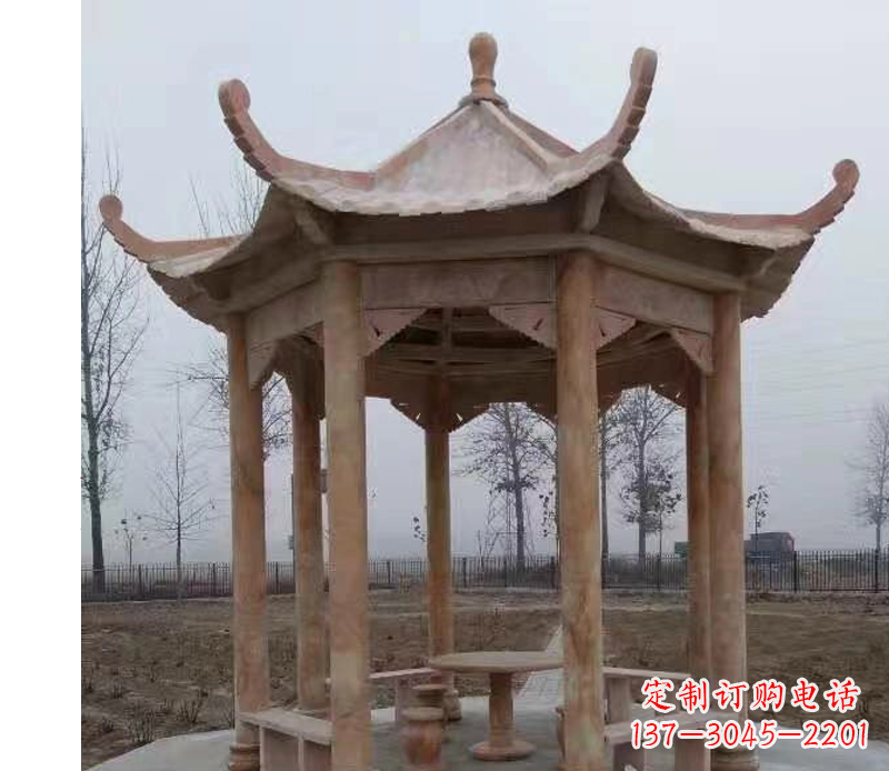 泰州公园晚霞红八角石雕凉亭